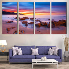 Load image into Gallery viewer, California Coast Canvas Print Purple Ocean Rocks Canvas Wall Art Yellow Cloudy Sky Ocean  4 piece Canvas In Living room
