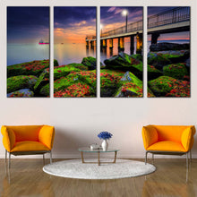 Load image into Gallery viewer, Cloudy Sunset Canvas Wall Art Blue Sky Pier Seascape 4 Piece Multi Canvas Artwork Green Boulders Sea  Canvas Print In Living room
