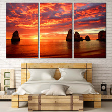 Load image into Gallery viewer, Ocean Rocks Canvas Wall Art Yellow Cliffs Ocean Sunset 3 Piece Multi Panel Canvas Dramatic Orange Clouds Sky Canvas Print For Bedroom
