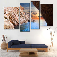 Load image into Gallery viewer, Ocean Sunset Canvas Wall Art Yellow Cloudy Sunrise Multi Canvas Looking Out Cave Ocean  4 Piece Canvas Print Brown Ocean Rocks For Your Living Room
