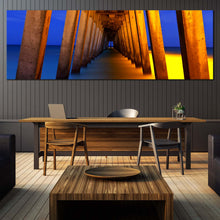 Load image into Gallery viewer, Pier  Pillars  Canvas  Wall  Art  Yellow  Pier  Ocean  Canvas  Artwork  Blue  Orange  Under  Pier  Living  Room  1  Piece  Canvas  Print In Dinning Room
