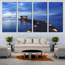 Load image into Gallery viewer, Pier Seascape Canvas Wall Art Yellow Wooden Pier Lights  4 Piece Canvas Print Blue Sea Pier in Maldives Canvas Set In Living room
