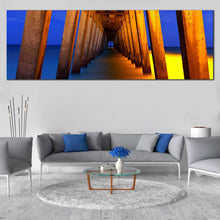 Load image into Gallery viewer, Under  Pier  Canvas  Print  Blue  Yellow  Pier  Ocean  Living  Room  1  Piece  Canvas  Artwork  Orange  Pier  Pillar  Sea  Panoramic  Canvas  Wall  Art In Living Room
