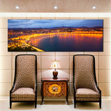 Load image into Gallery viewer, la  concha  bay  canvas  print  night  lights  san  sebastian  city  yellow  sky  beach  panoramic  canvas  wall  art  In Living Room
