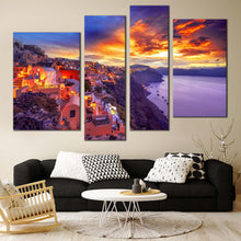 Load image into Gallery viewer, mystic sunset retreat 4 piece canvas of dramatic clouds over santorini island with yellow oia sky wall art In Living Room
