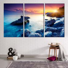 Load image into Gallery viewer, ocean boulders canvas wall art dramatic yellow sunset sky canvas print crimea ukraine blue ocean rocks 3 piece canvas set
