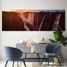 Load image into Gallery viewer, victoria  falls  canvas  wall  art  zimbabwe  yellow  cloudy  sunset  waterfall  canvas  print  orange  zambezi  river  waterfall  nature  panorama  canvas In Living Room
